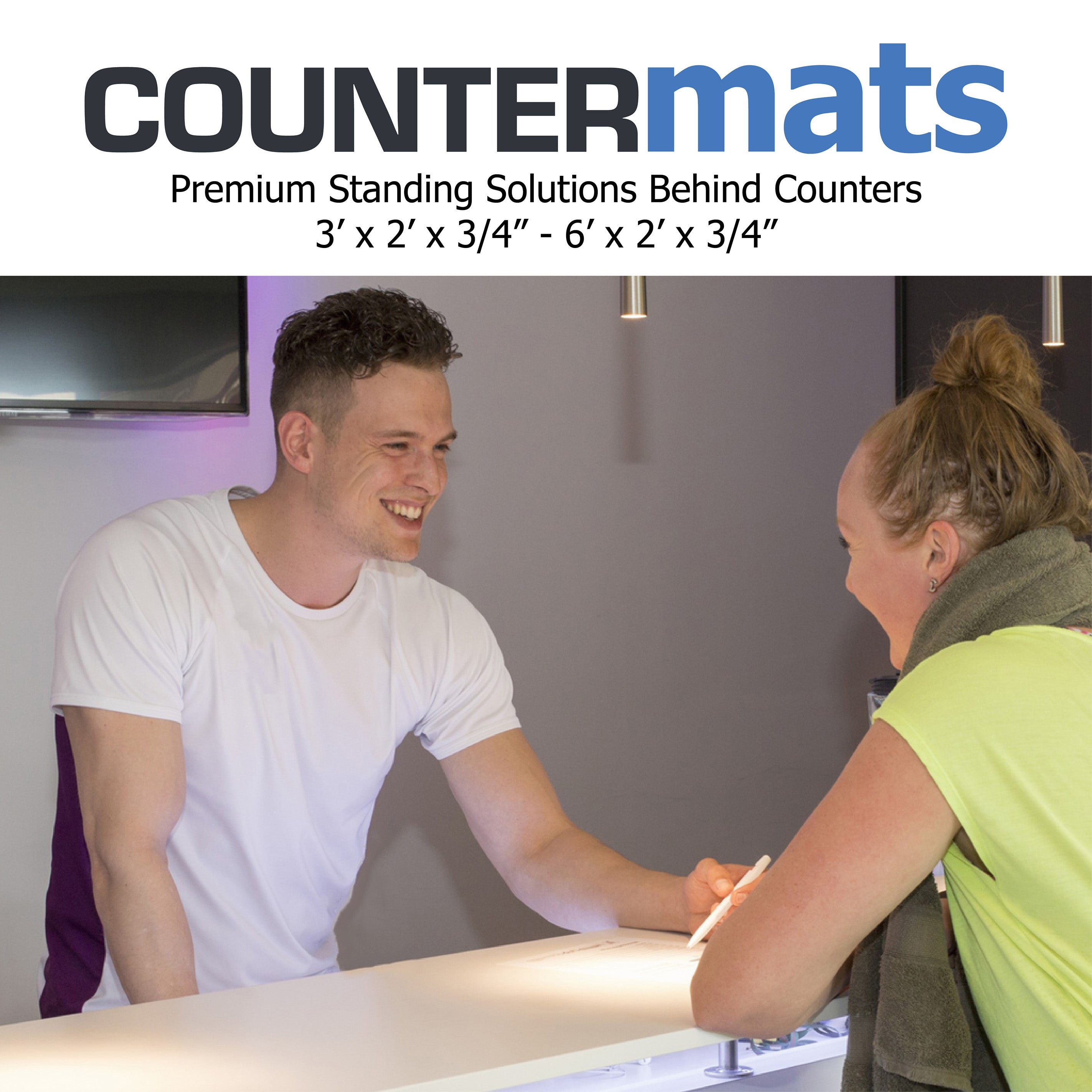 Happy gym employee behind counter helping customer