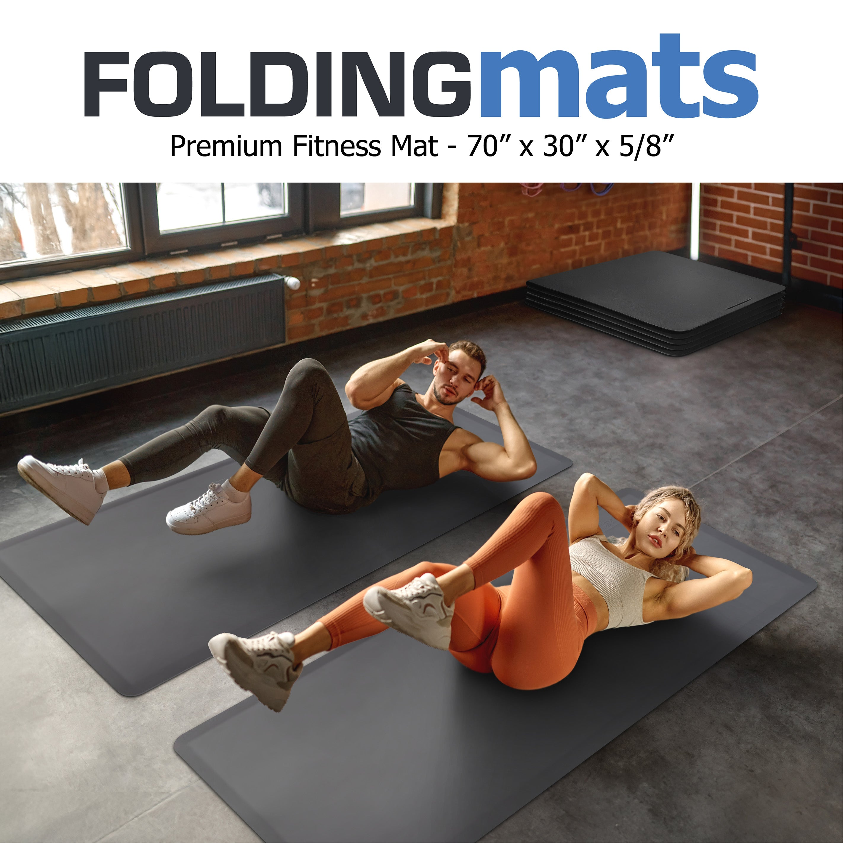 Couple in studio gym doing bicycle crunches on foldable fitness mats