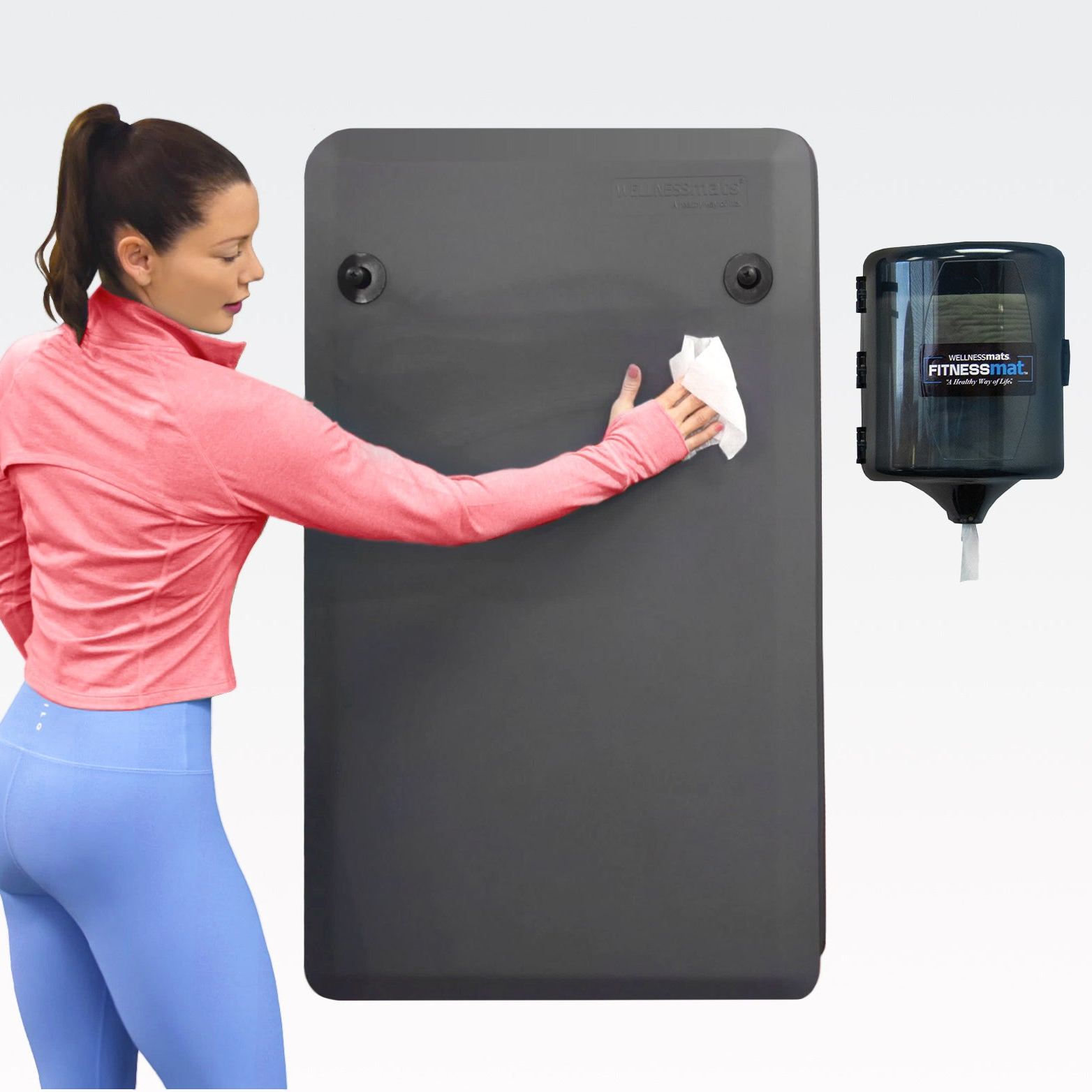 Woman wiping down a FitnessMat with cleaning wipe