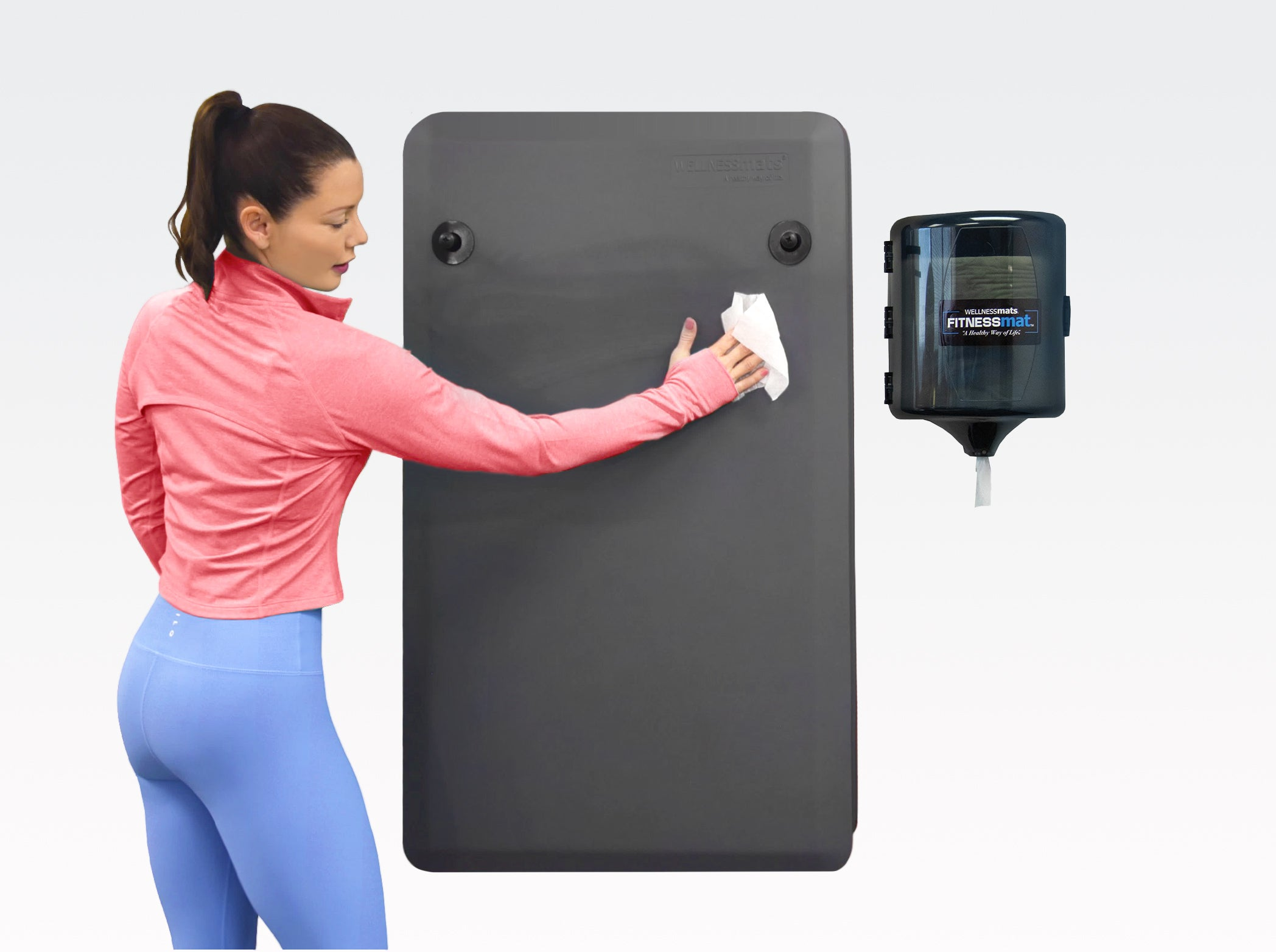 Woman wiping down a FitnessMat with cleaning wipe