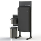 A standing sanitizing station that holds FitnessMats that includes a trash can and wipes.