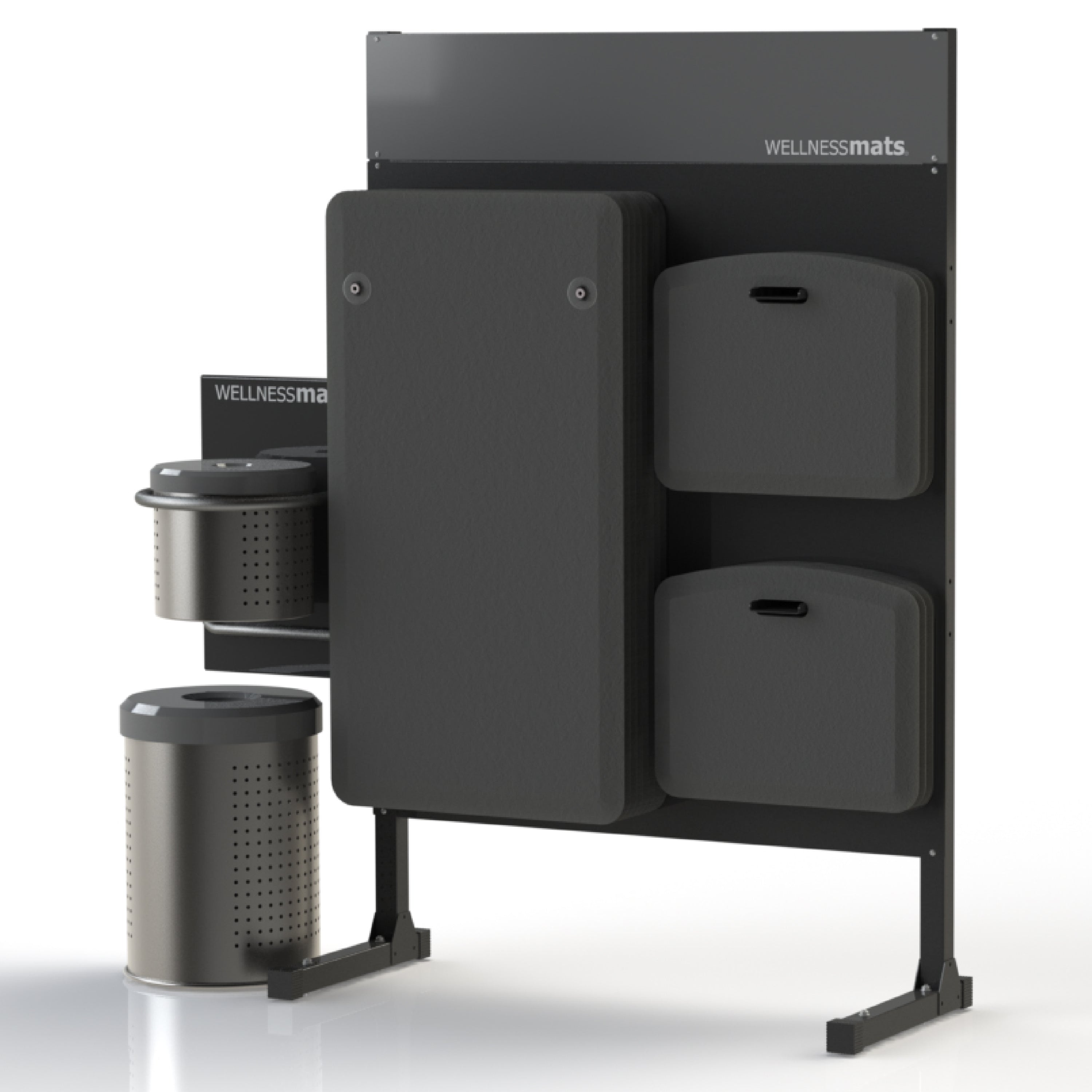 A standing sanitizing station that holds FitnessMats and MobileMats on the same side of the station that includes a trash can and wipes.