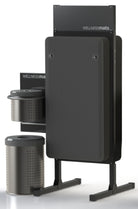 A standing sanitizing station that holds FitnessMats on both sides of the stand that includes a trash can and wipes.